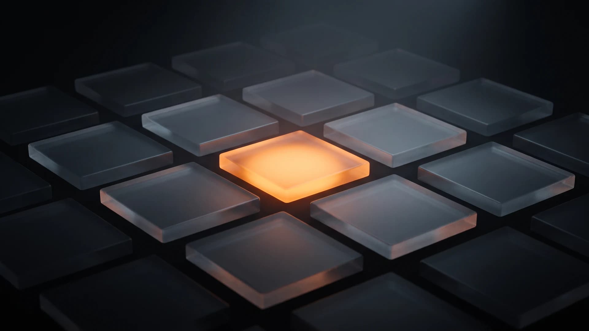 A grid of dark glass tiles with one tile in the centre glowing orange